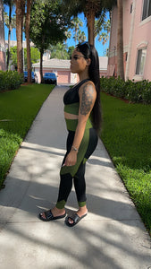 Black and green yoga pants and bra top